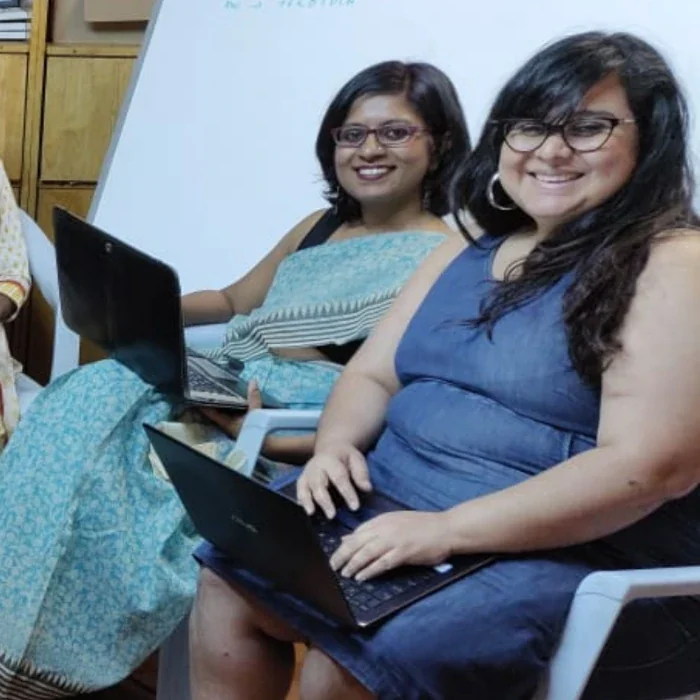 Shobha SV and Padmini laughing and working together at the #VisibleWikiWomen edit-a-thon held in Bangalore